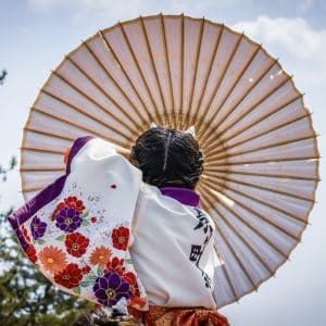japanese girl carrying traditional umbrella during a spring estival