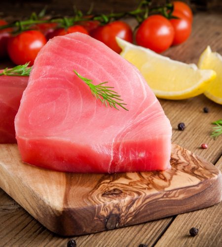 Raw tuna fillet with dill, lemon and cherry tomatoes